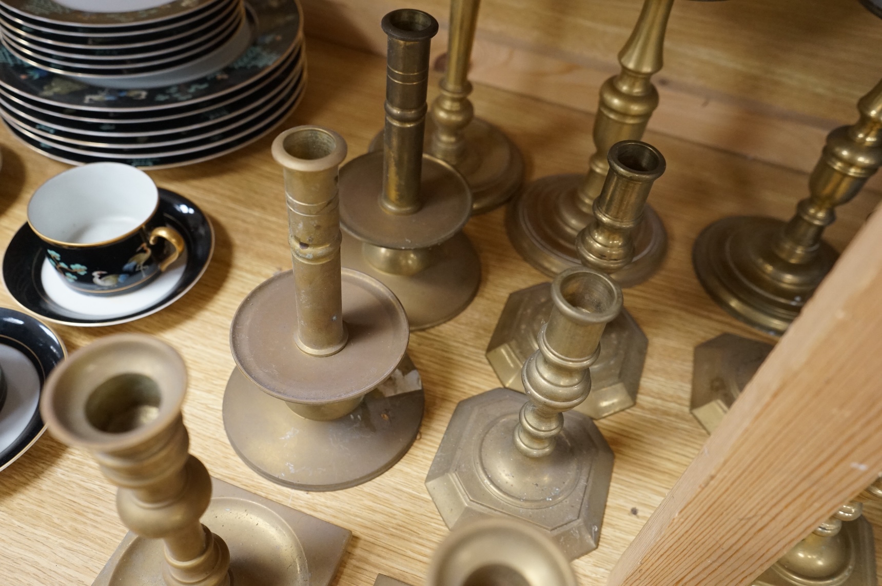 A collection of 19th century and later brass candlesticks, largest 33cm high